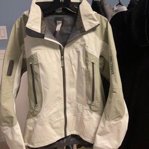 Used once ARCTERYX hooded ski shell with avalanche rescue system